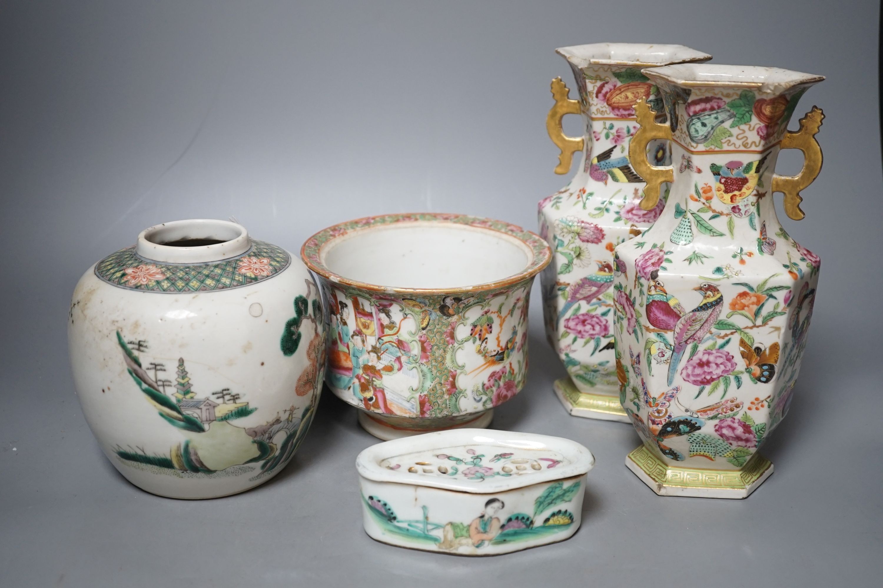 A group of 19th-century Chinese enamelled porcelain vessels, to include a jar, a pair of hexagonal vases, a pot and a cricket cage, Pair of vases 22cm high.